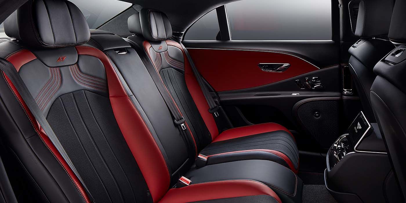 Bentley Cairo Bentley Flying Spur S sedan rear interior in Beluga black and Hotspur red hide with S stitching
