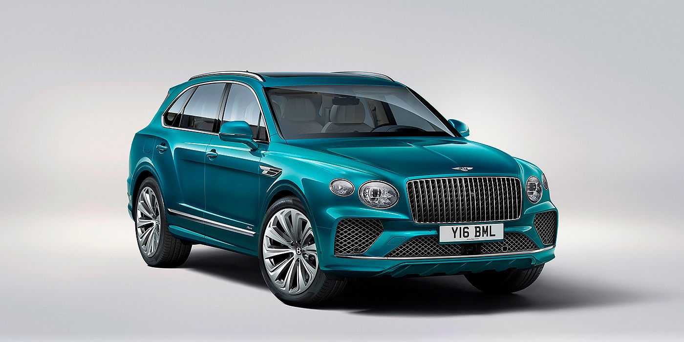 Bentley Cairo Bentley Bentayga Azure front three-quarter view, featuring a fluted chrome grille with a matrix lower grille and chrome accents in Topaz blue paint.