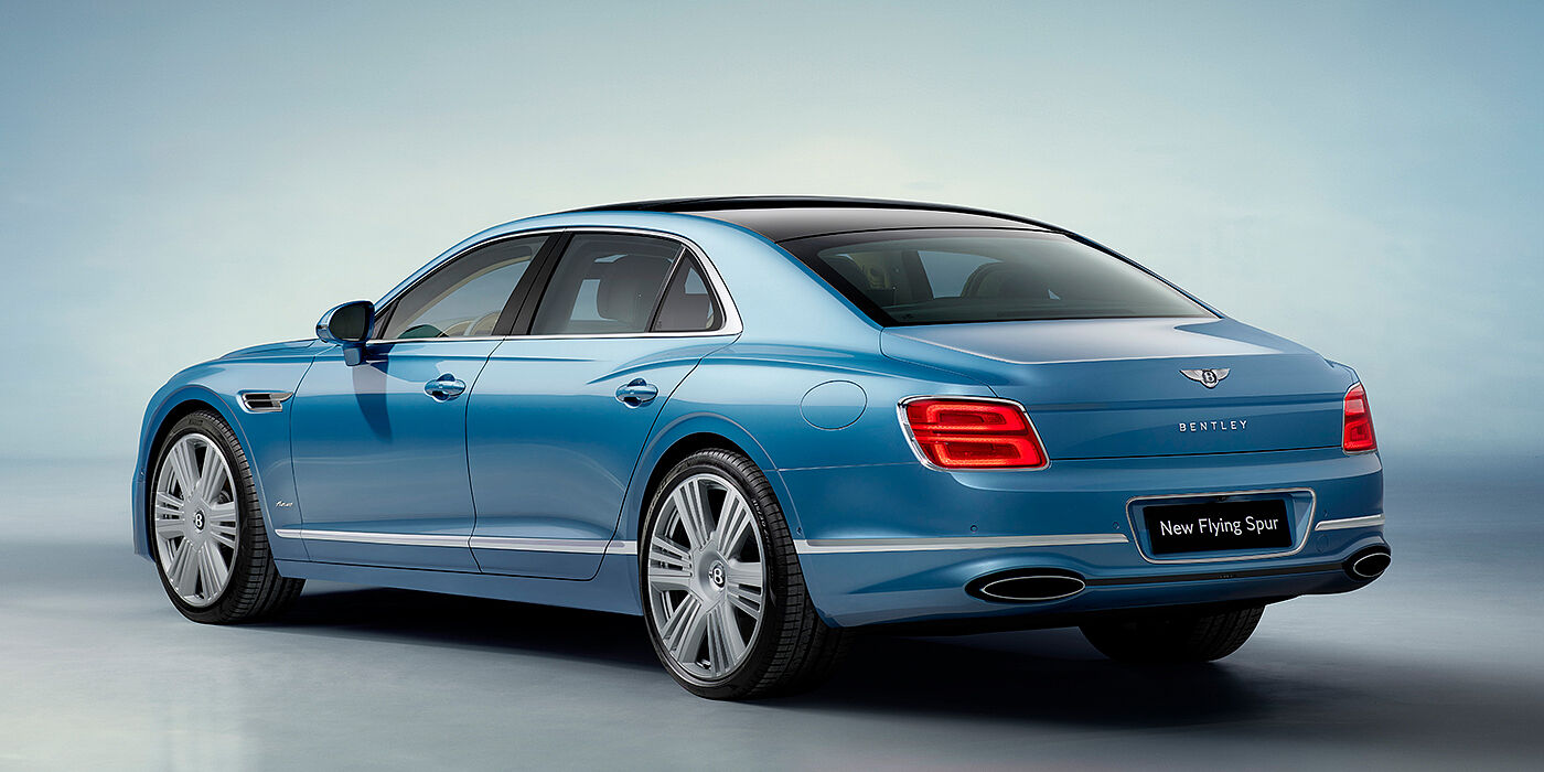Bentley Cairo New Bentley Flying Spur Azure sedan rear view in Light windsor blue by Mulliner paint with 22 inch Azure wheels and chrome exterior details