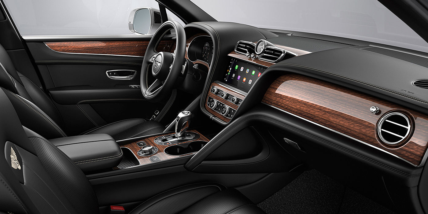 Bentley Cairo Bentley Bentayga interior with a Crown Cut Walnut veneer, view from the passenger seat over looking the driver's seat.