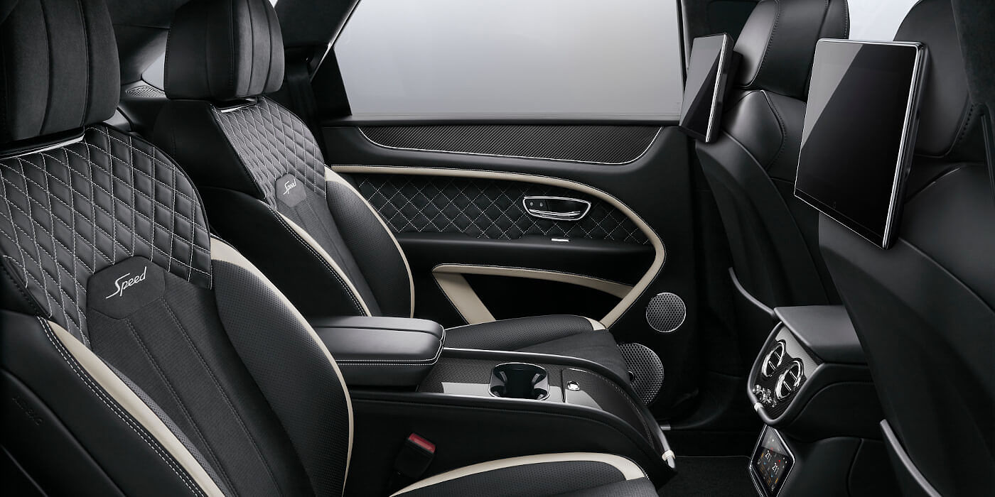 Bentley Cairo Bentley Bentayga Speed SUV rear interior in Beluga black and Linen hide with carbon fibre veneer