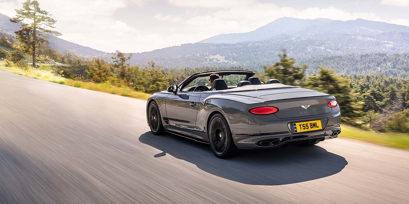 Bentley Cairo Bentley Continental GTC S convertible in Cambrian Grey paint rear 34 dynamic driving