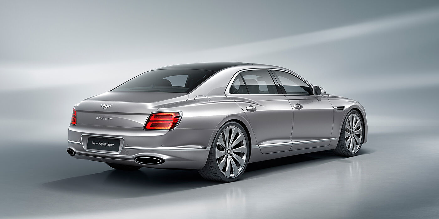Bentley Cairo New Bentley Flying Spur sedan rear view in Silverlake paint with ten spoke wheels and chrome matrix grille