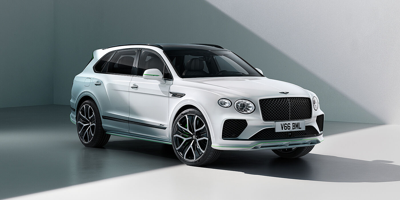 Bentley Cairo Bentley Bentayga Speed SUV front three quarter in Snow Quartz Pearlescent by Mulliner white paint against a grey wall