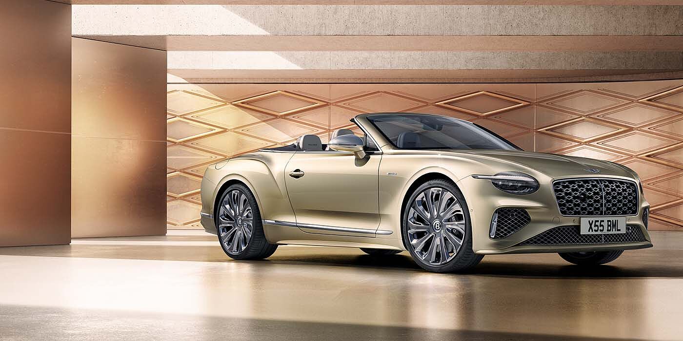 Bentley Cairo Bentley New Continental GTC Mulliner V8 hybrid front three quarters in Patina paint