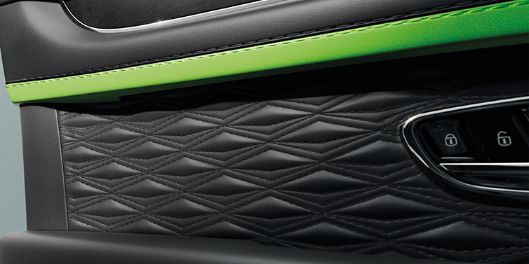 Bentley Cairo Bentley Bentayga Speed SUV interior door detail with Diamond in Diamond stitched hide in Beluga black colour, with Black stained Crown Cut Walnut veneer