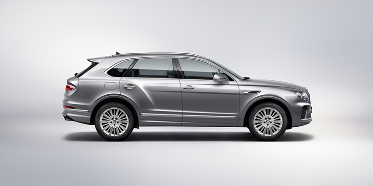 Bentley Cairo Bentley Bentayga SUV side profile in Moonbeam silver paint against white background featuring 21 inch 5 spoke wheels
