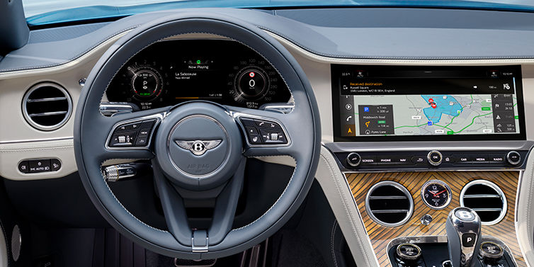 Bentley Cairo New Bentley Continental GT Azure coupe front interior in Linen and Brunel blue hides, showing steering wheel and driver's instruments